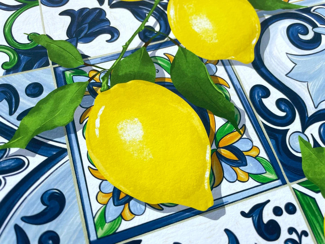 Detailed view of an art print of bright yellow Sicilian lemons over beautiful Italian tiles. This juicy fruit art print will bring colour and fun into any kitchen. The perfect wall art for a foodie or Italy enthusiast.